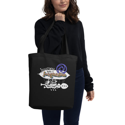 Logo inspired by EPCOT's Journey into Imagination, in rainbow colors atop an airship, on a Black tote — worn stylishly by a model