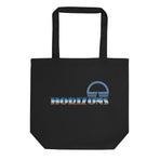 A logo for the classic EPCOT attraction, Horizons, text displaying with a sharp horizon line running through it, gradient to sky above and earth below., on a Black tote — flat lay