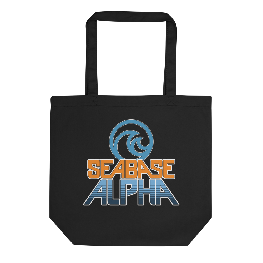 Orange and blue SeaBase Alpha logo with The Living Seas Pavilion icon above, on a Black tote — flat lay