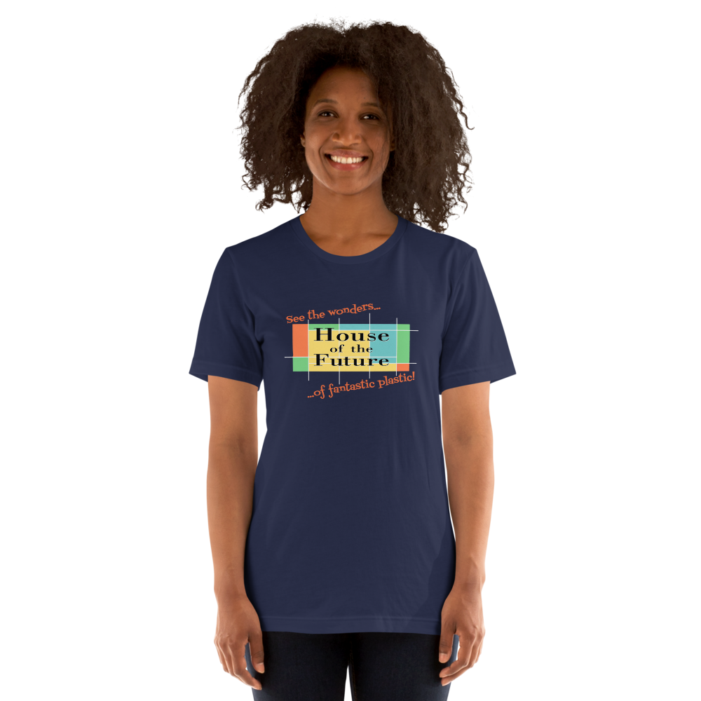 Logo inspired by the former attraction, House of the Future, with retro-styled text reading "See the Wonders of Fantastic Plastic!", on a Navy tee — worn stylishly by a model