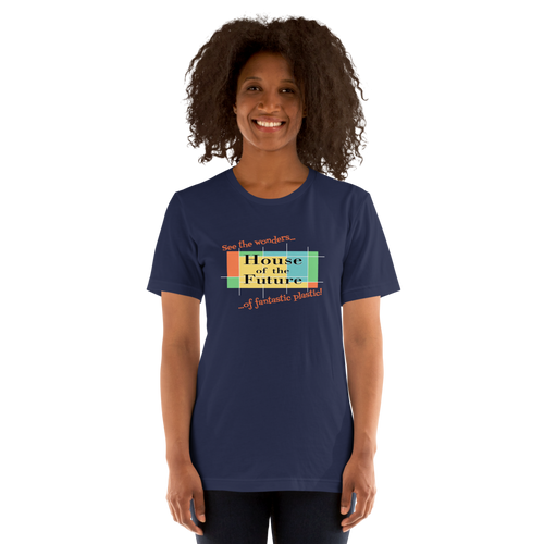 Logo inspired by the former attraction, House of the Future, with retro-styled text reading "See the Wonders of Fantastic Plastic!", on a Navy tee — worn stylishly by a model