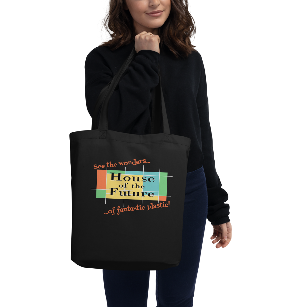Logo inspired by the former attraction, House of the Future, with retro-styled text reading "See the Wonders of Fantastic Plastic!", on a Black tote — worn stylishly by a model