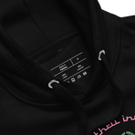 Logo inspired by the attraction with pink stylized retro text reading Adventures Thru Inner Space in a circle, surrounding atomic shaped text in green reading Miracles from Molecules, on a Black hoodie — fabric detail