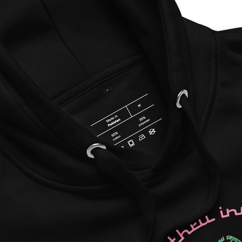 Logo inspired by the attraction with pink stylized retro text reading Adventures Thru Inner Space in a circle, surrounding atomic shaped text in green reading Miracles from Molecules, on a Black hoodie — fabric detail