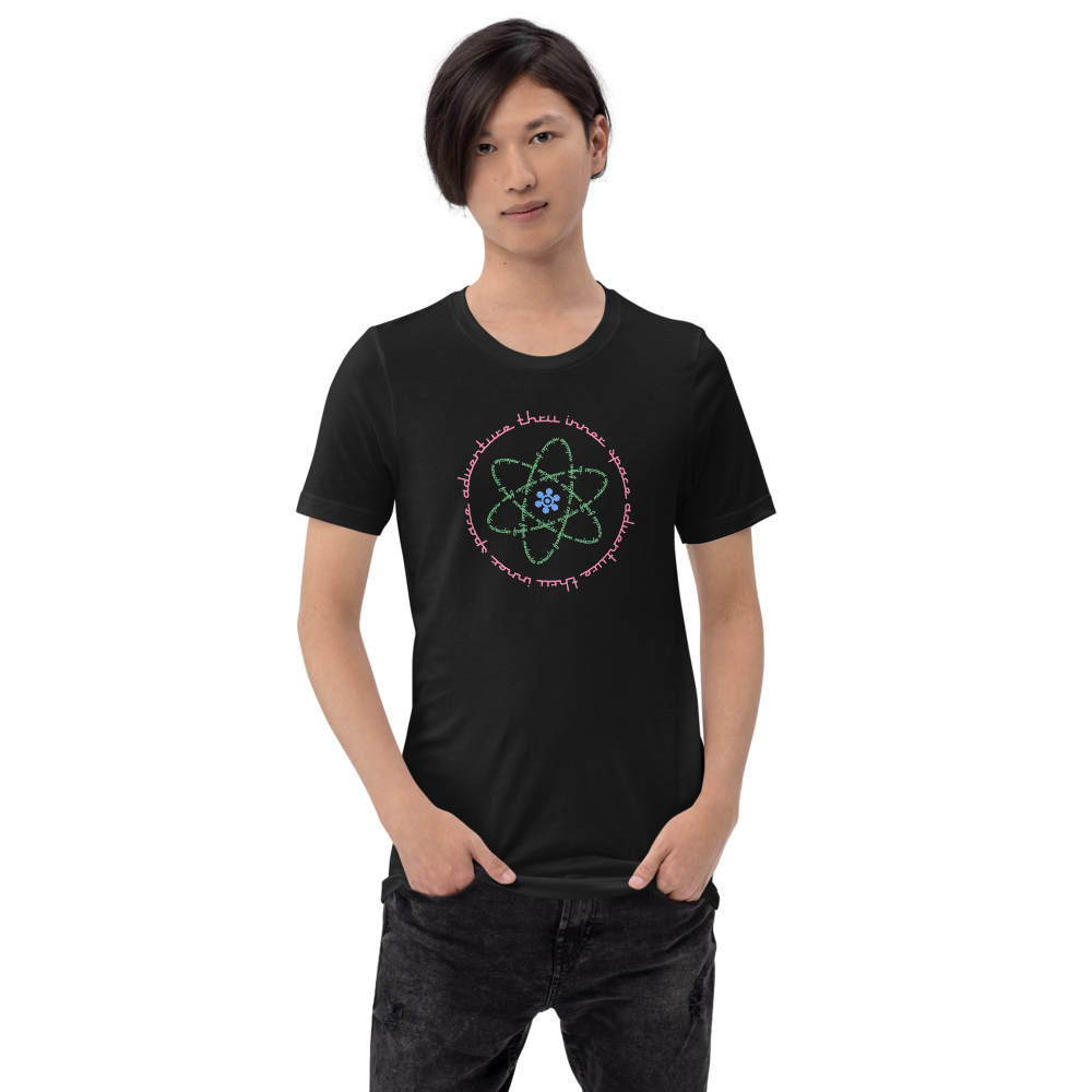 Logo inspired by the attraction with pink stylized retro text reading Adventures Thru Inner Space in a circle, surrounding atomic shaped text in green reading Miracles from Molecules, on a Vintage Black tee — worn stylishly by a model