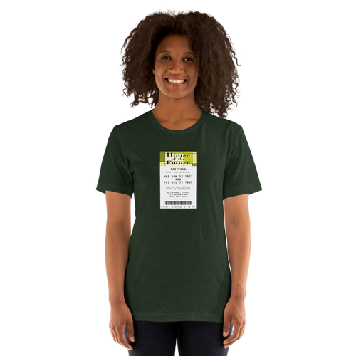Imagined FASTPASS designed for the House of the Future attraction, with retro yellow-toned attraction logo, on a tee — worn stylishly by a model