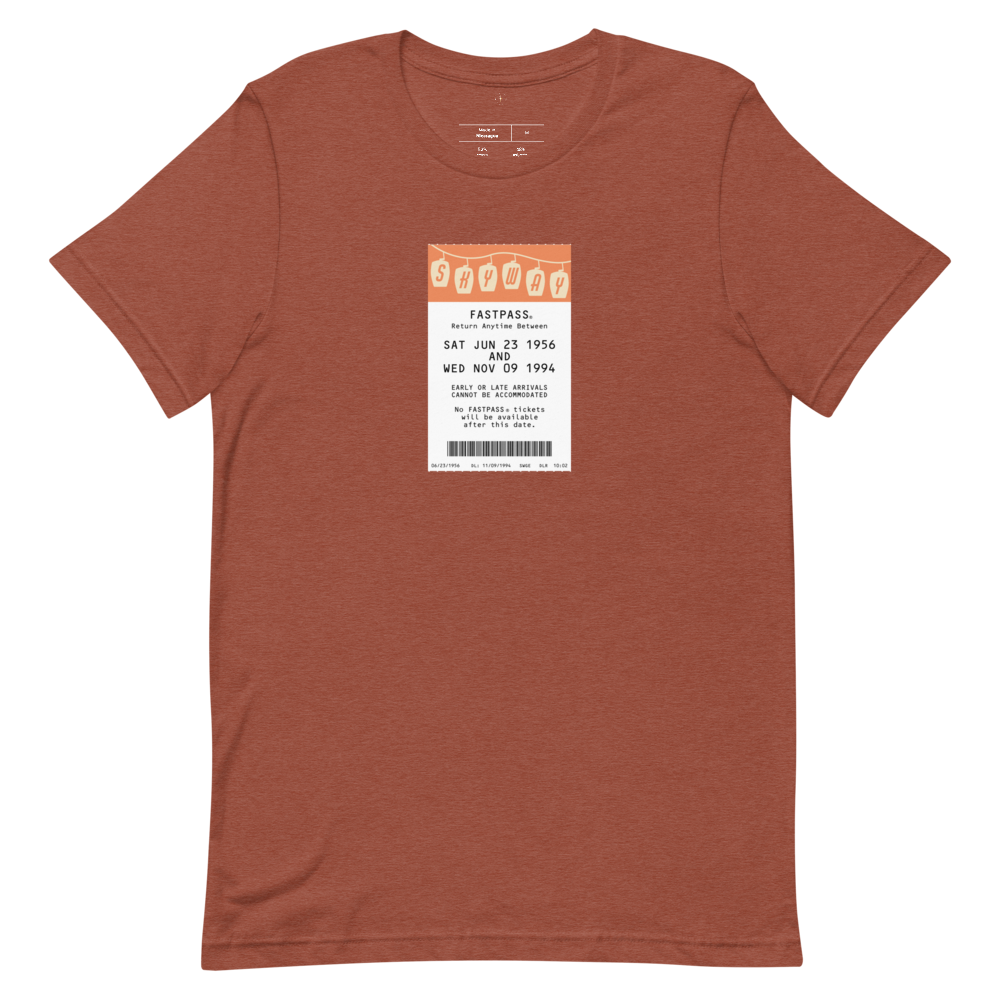 Imagined FASTPASS designed for the Skyway transportation system, with retro orange-toned attraction logo, on a tee — flat lay