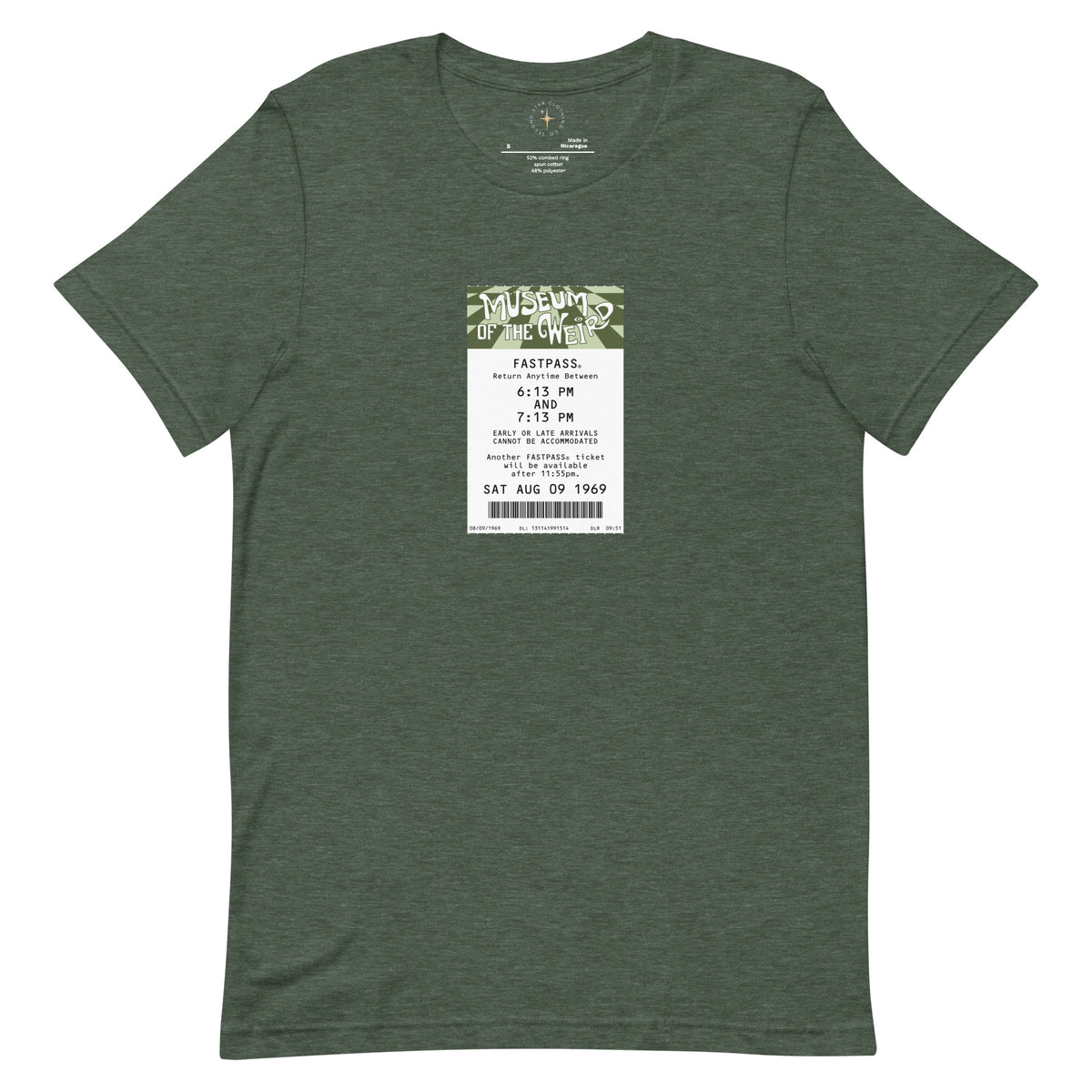 Imagined FASTPASS designed for the unbuilt Museum of the Weird attraction, with green-toned attraction logo, on a tee — flat lay